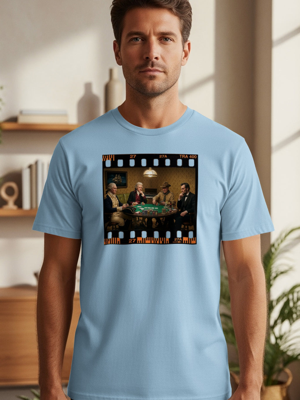 Historical figures playing poker in a film strip design on a light blue t-shirt.