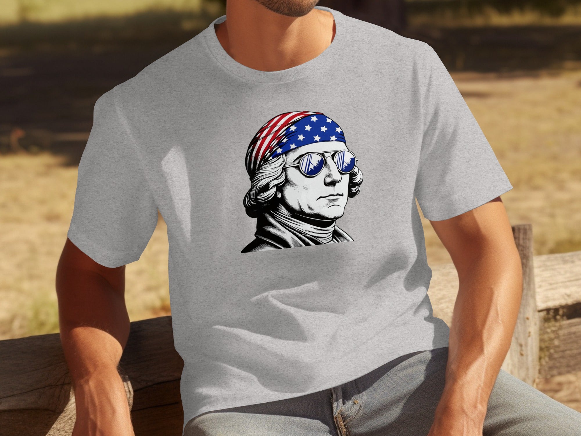 George Washington wearing sunglasses and a US flag bandana on a grey t-shirt.