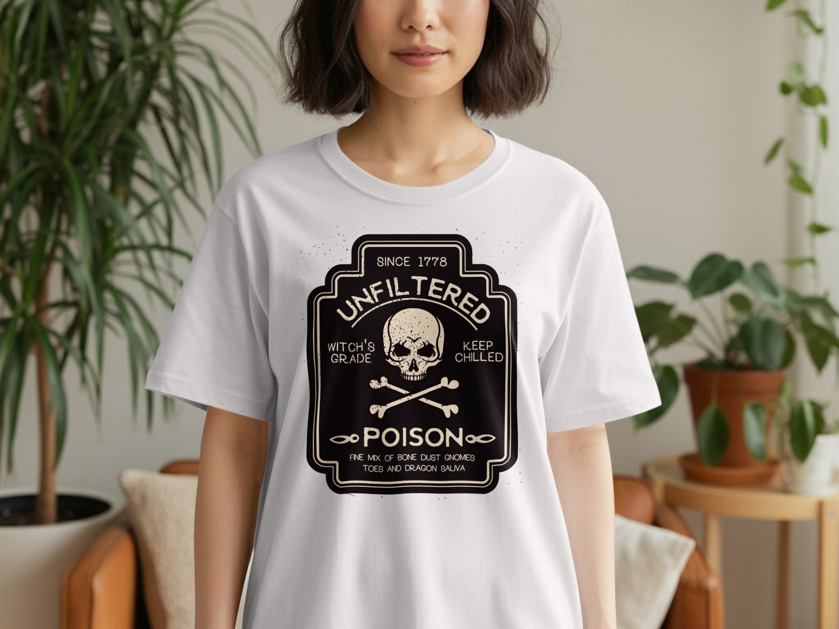 White t-shirt with black graphic: "Unfiltered Poison", skull, bones, "Since 1778", "Keep Chilled".