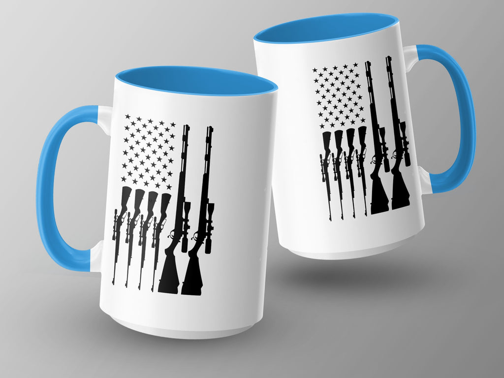 Two white mugs with blue handles and rims, featuring a black American flag design with rifles.