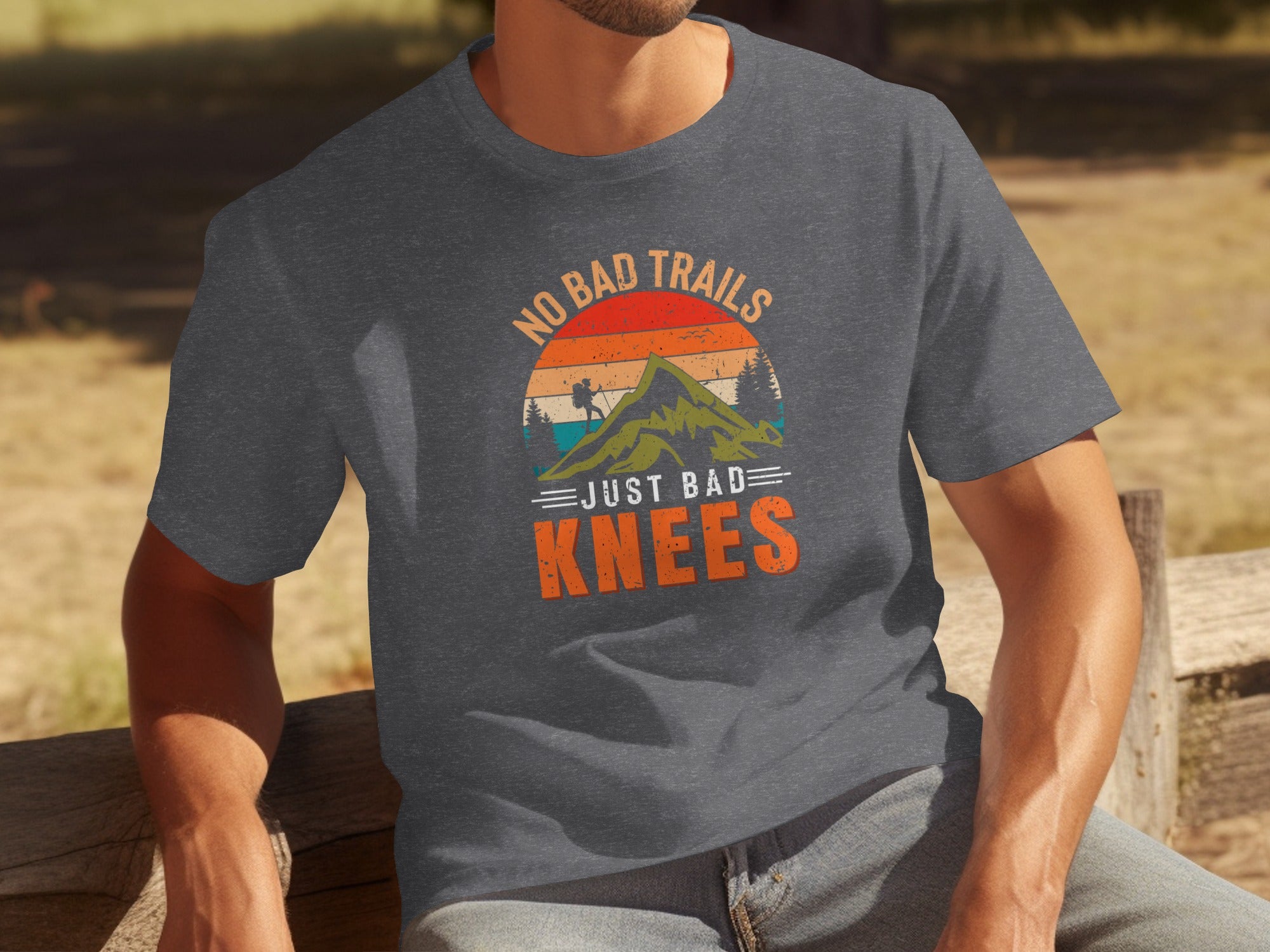 Dark grey t-shirt with vintage graphic: "No Bad Trails Just Bad Knees".