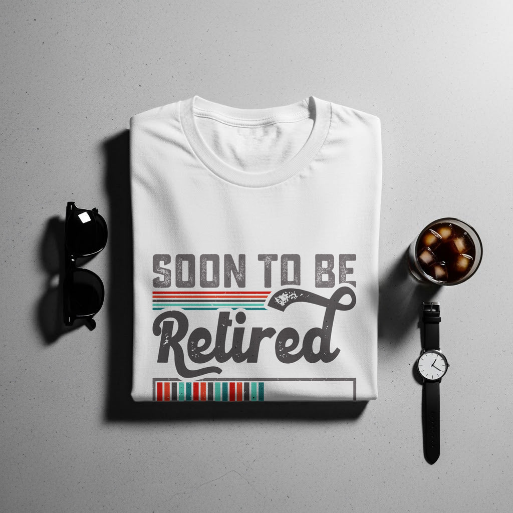 White t-shirt with "Soon To Be Retired" text and retro stripes.