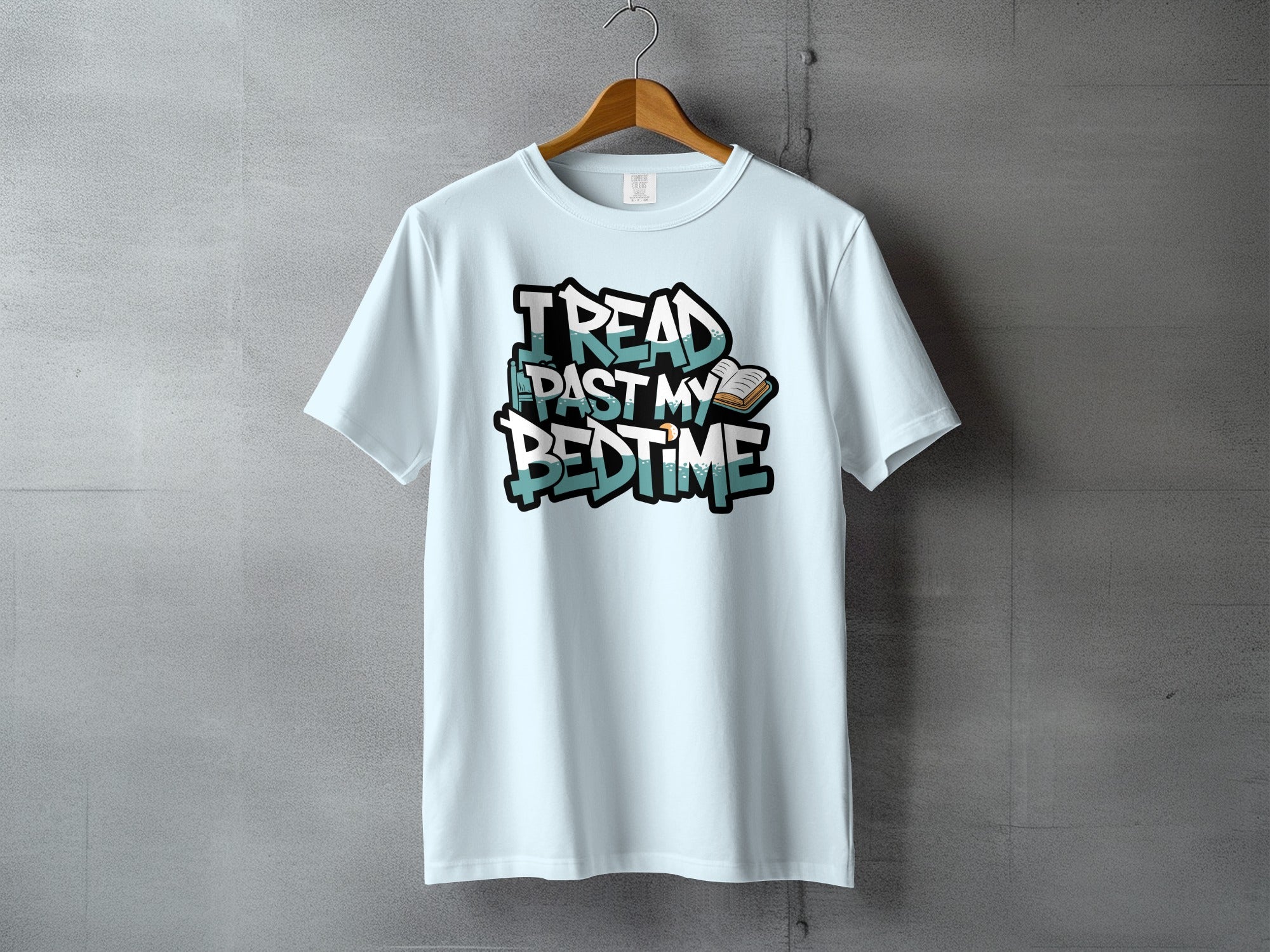 Light blue t-shirt with "I READ PAST MY BEDTIME" text and an open book.