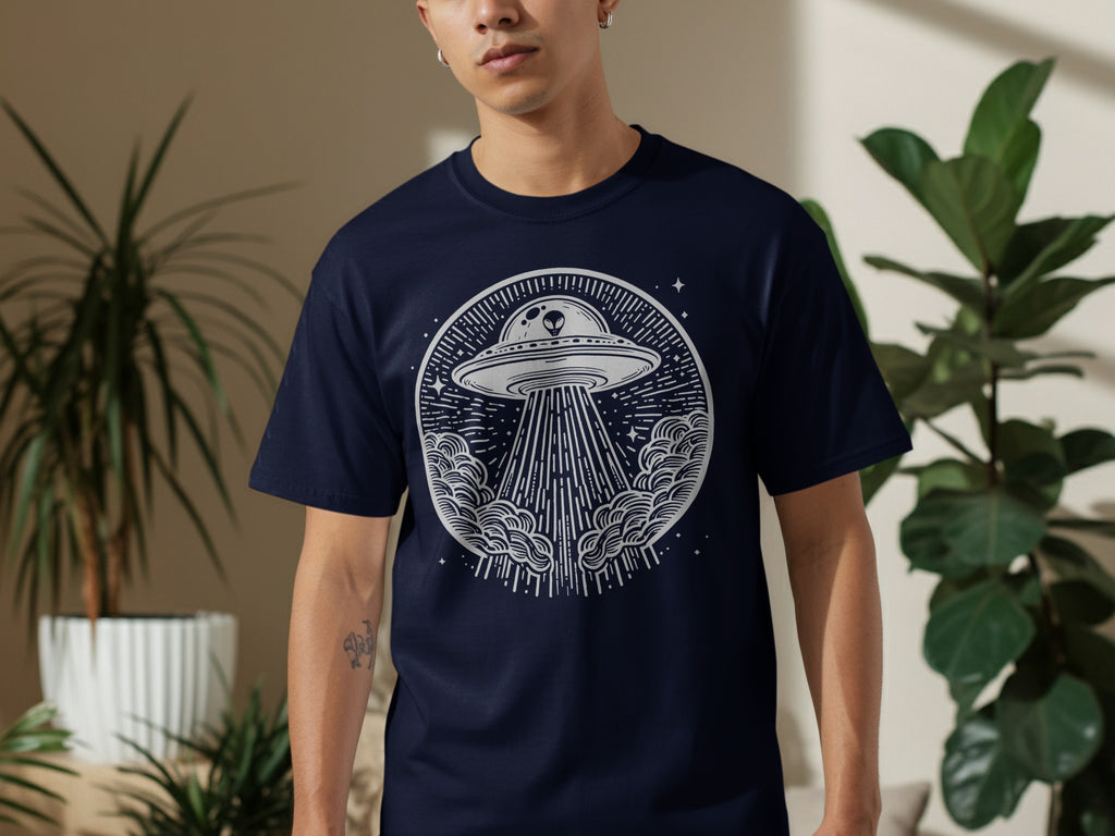 Navy t-shirt with white circular graphic of a UFO beaming light down onto clouds.