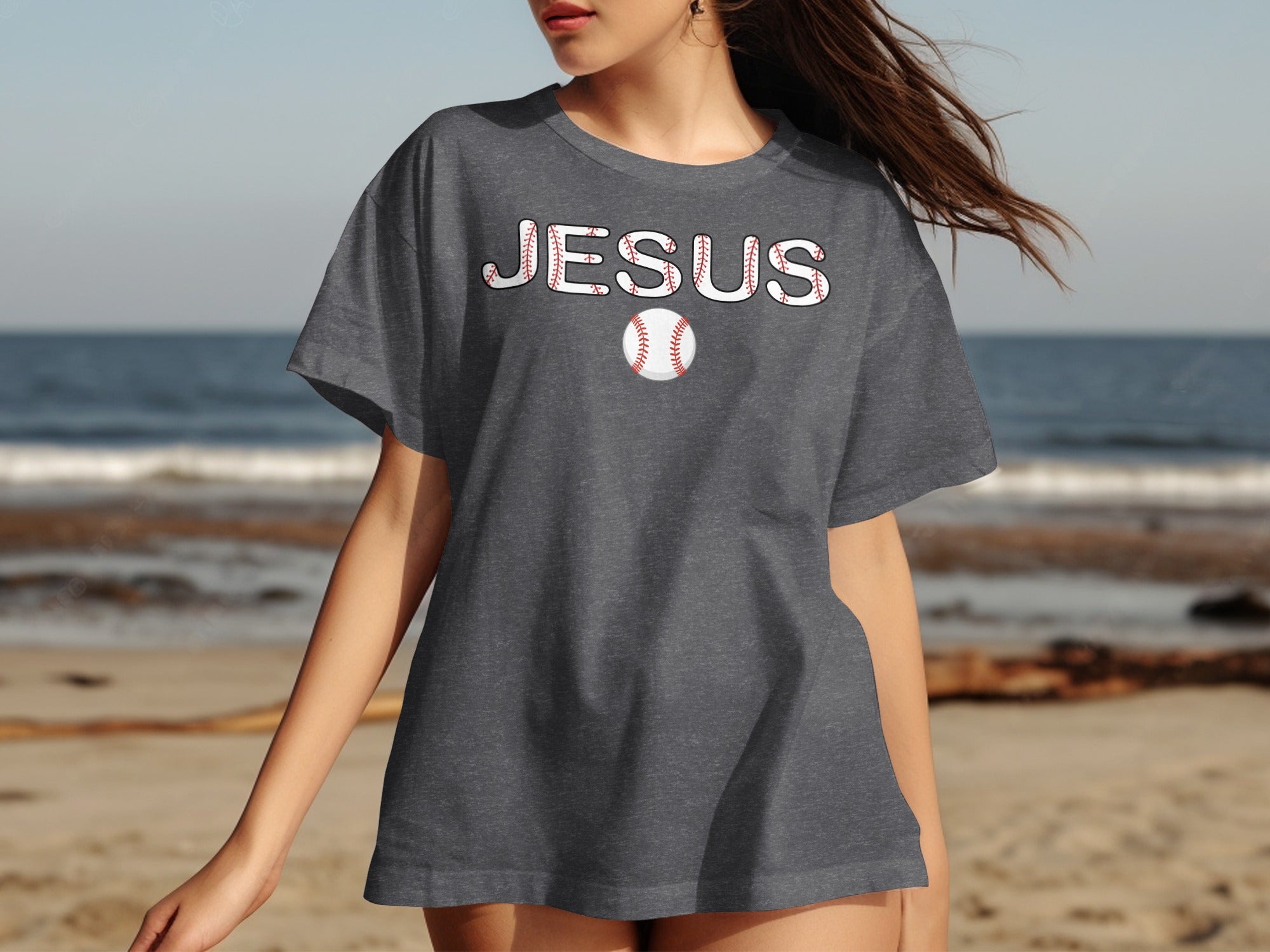 Dark grey t-shirt with "JESUS" in baseball stitch font and a baseball.