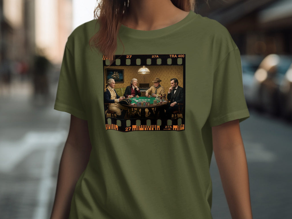 Historical figures playing poker within a film strip border on a green t-shirt.