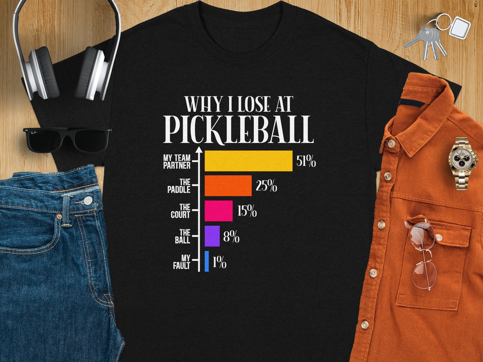 Black t-shirt with "Why I Lose at Pickleball" graphic and a bar chart of excuses.