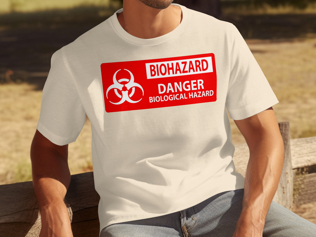 Cream t-shirt with a red biohazard danger biological hazard warning sign graphic.