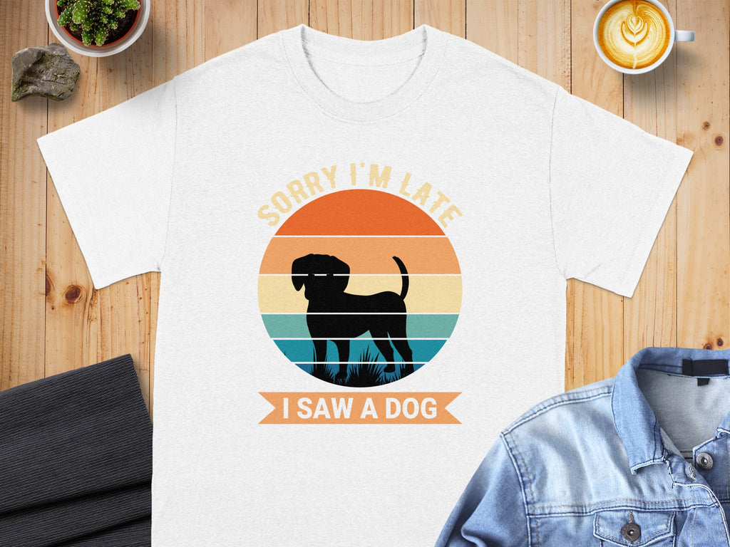 White t-shirt with retro sunset graphic and text "Sorry I'm Late I Saw A Dog".
