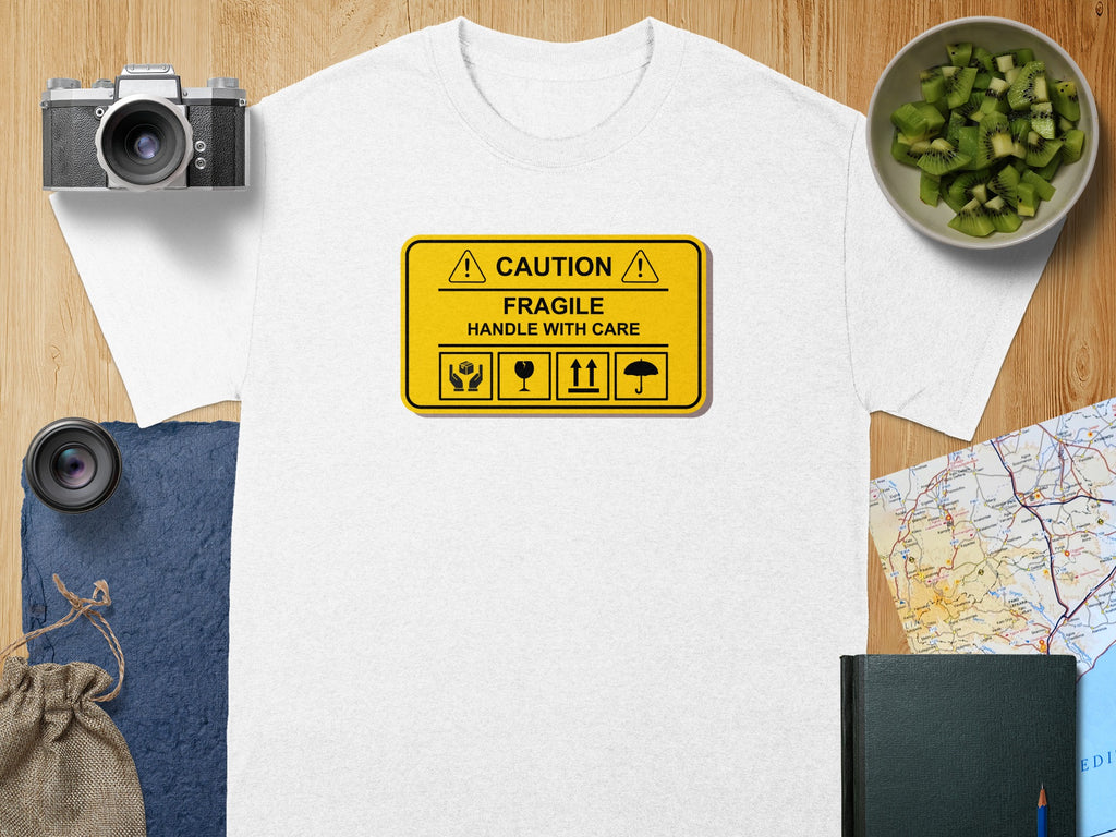 White t-shirt with a yellow "Caution Fragile Handle With Care" sign design.