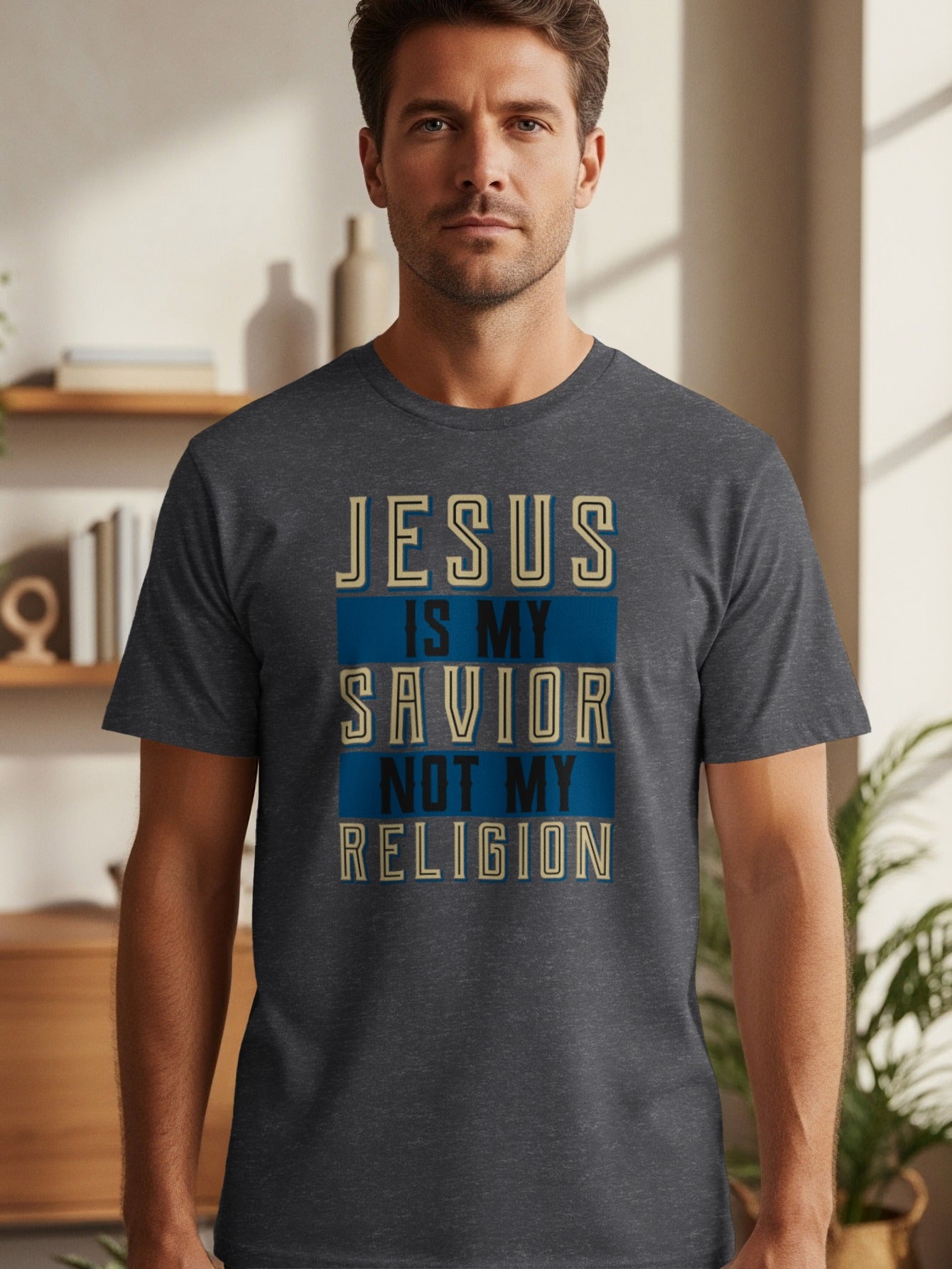 Dark grey t-shirt with text "JESUS IS MY SAVIOR NOT MY RELIGION".
