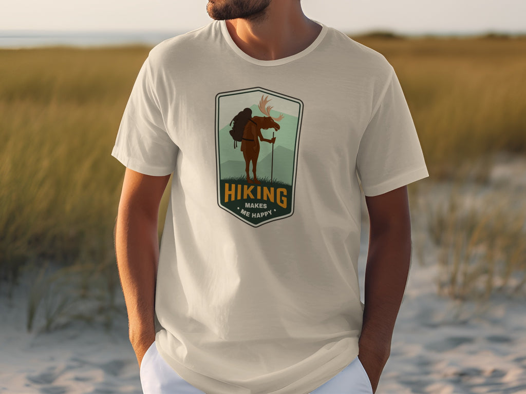 T-shirt with a graphic of a moose hiking, text reads "Hiking Makes Me Happy".