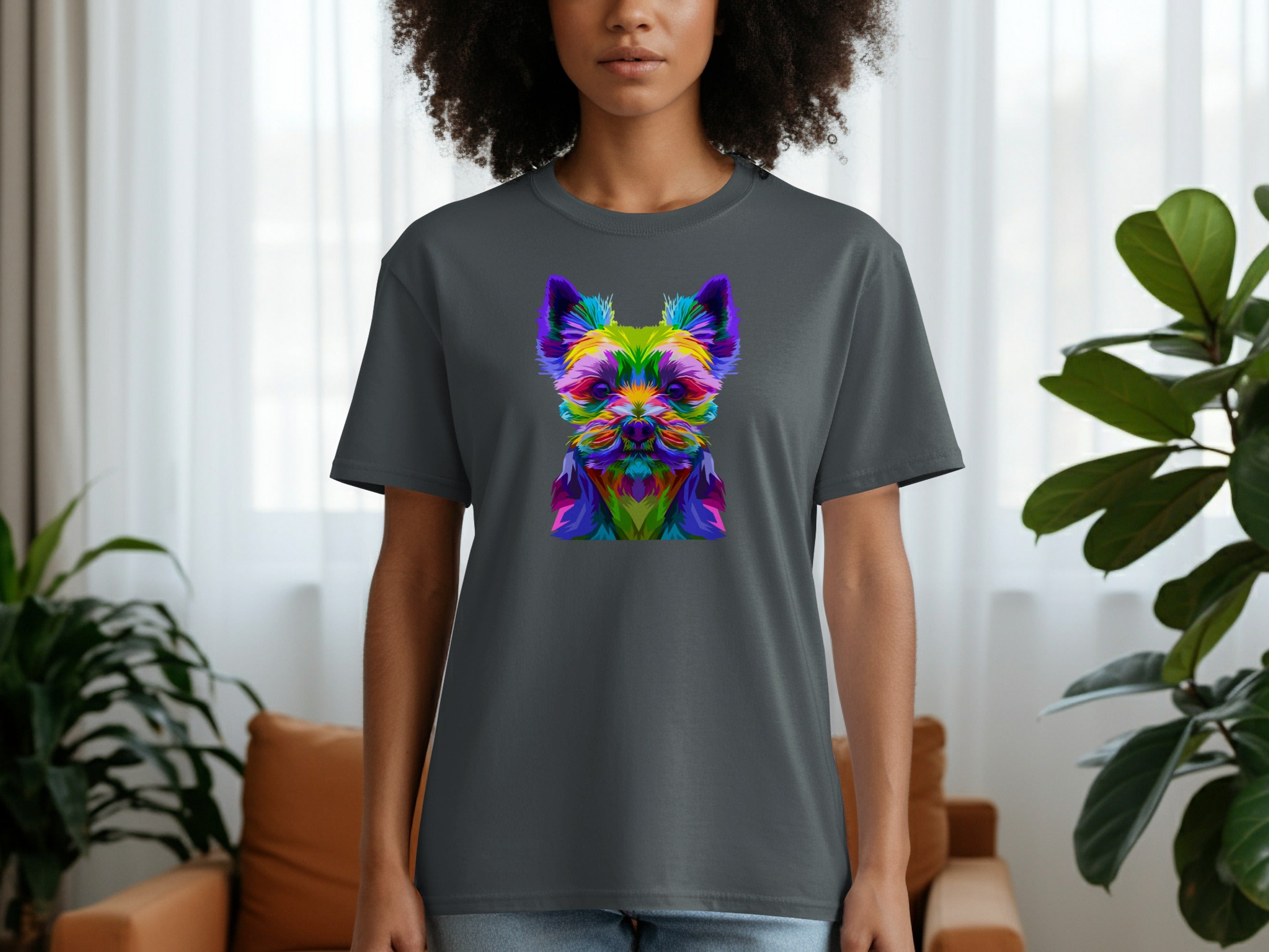 A person wears a dark gray t-shirt with a colorful geometric dog graphic design.