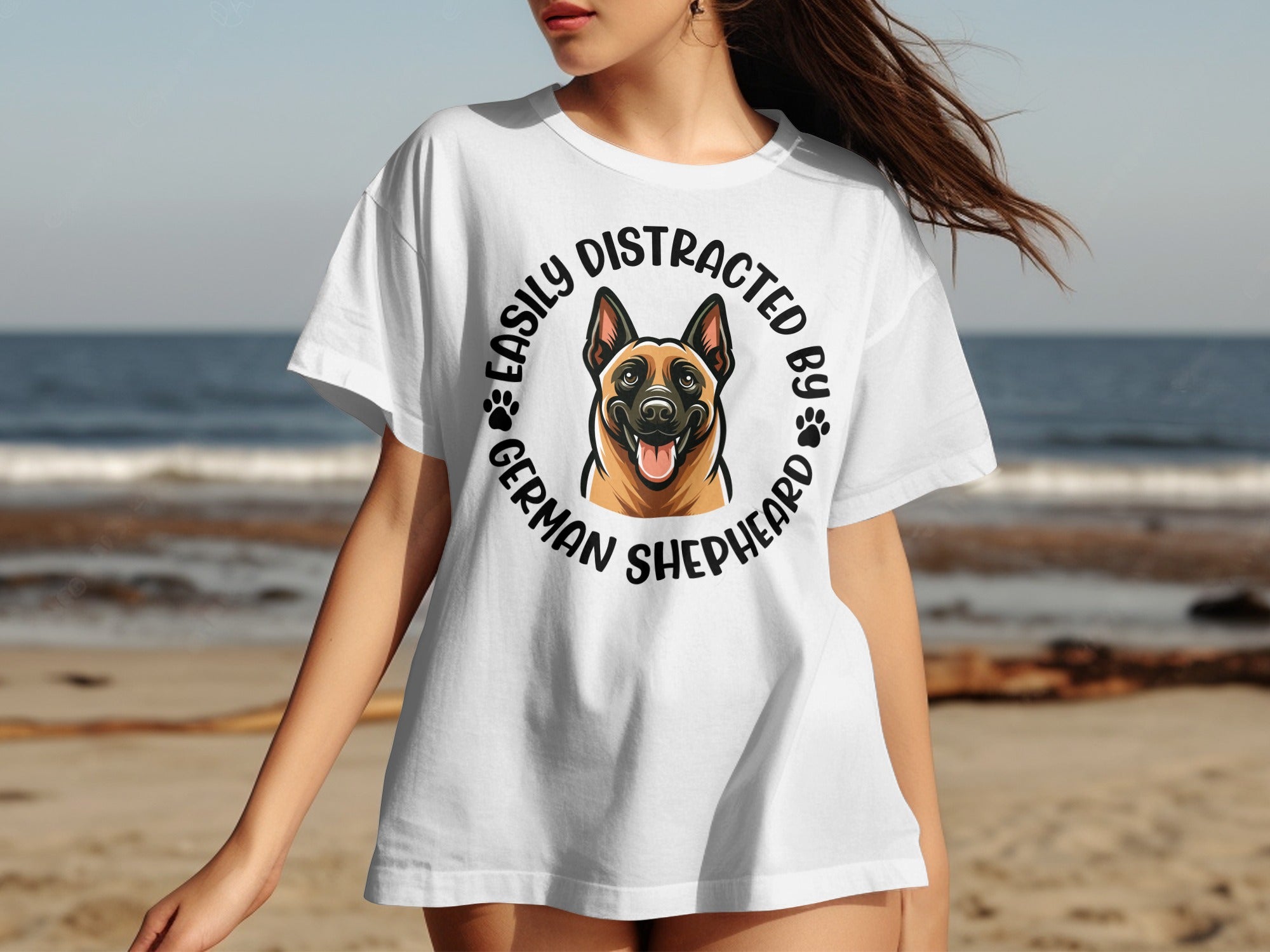 White t-shirt with a circular graphic featuring a German Shepherd and paws, text reads "Easily Distracted by German Shepherds".