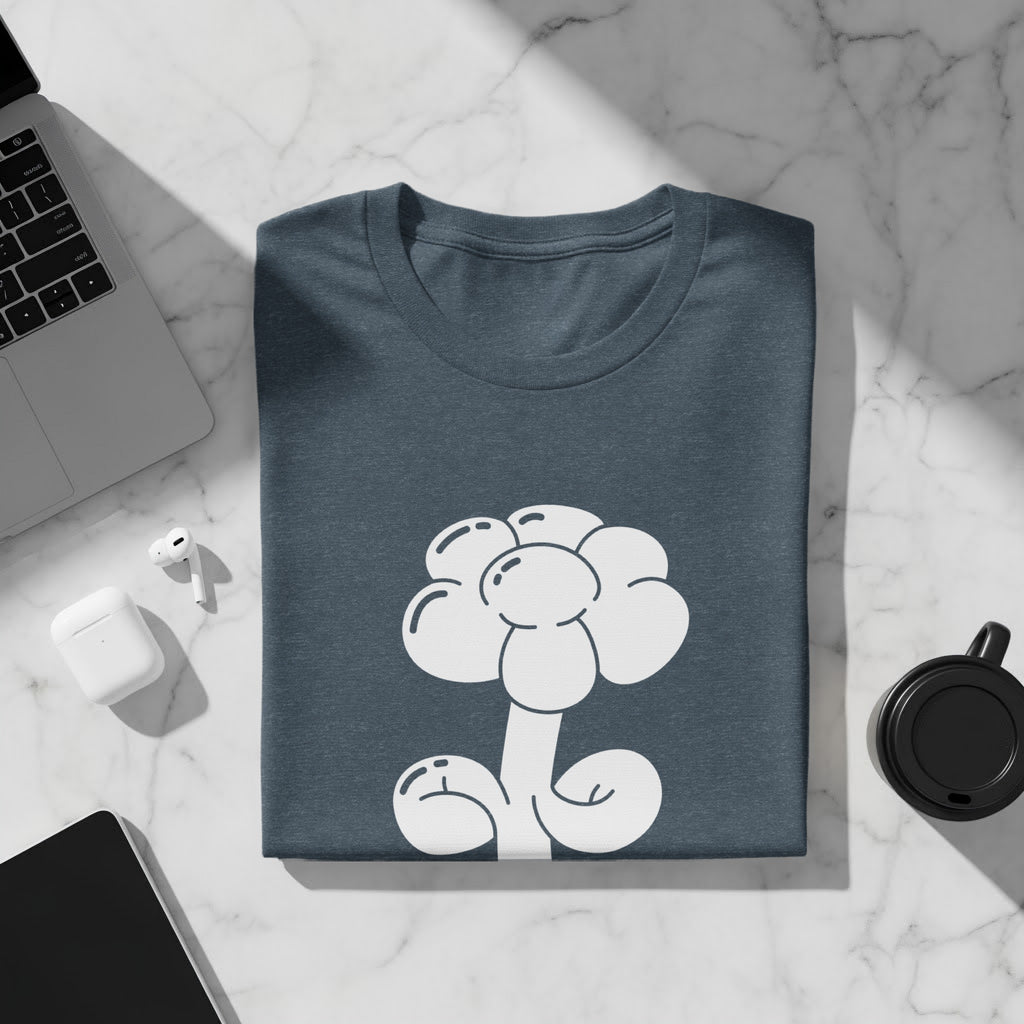Dark blue t-shirt with a white cartoon flower graphic on a marble surface.
