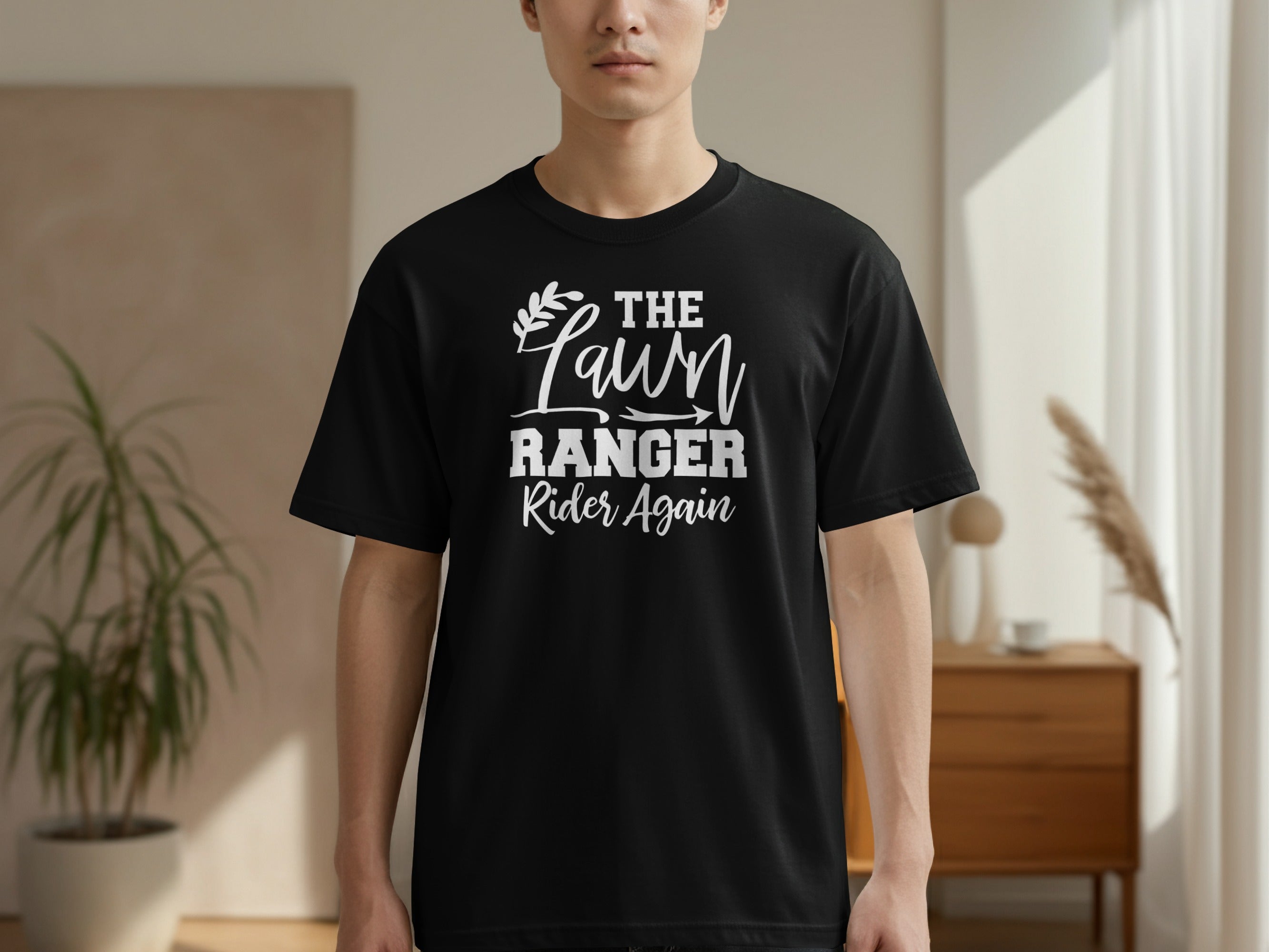Black t-shirt with "The Lawn Ranger Rider Again" text in white.