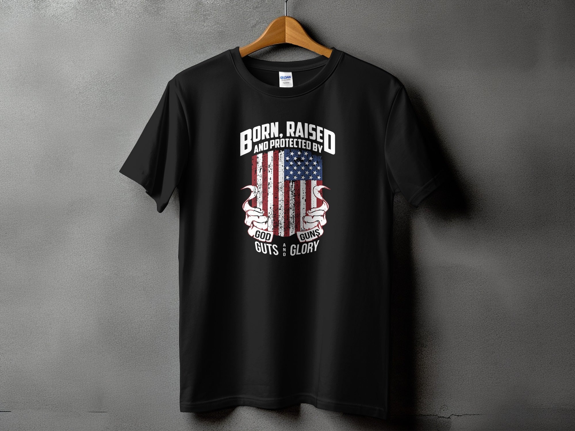 Black t-shirt with American flag and "Born, Raised and Protected By God, Guns, Guts & Glory" text.