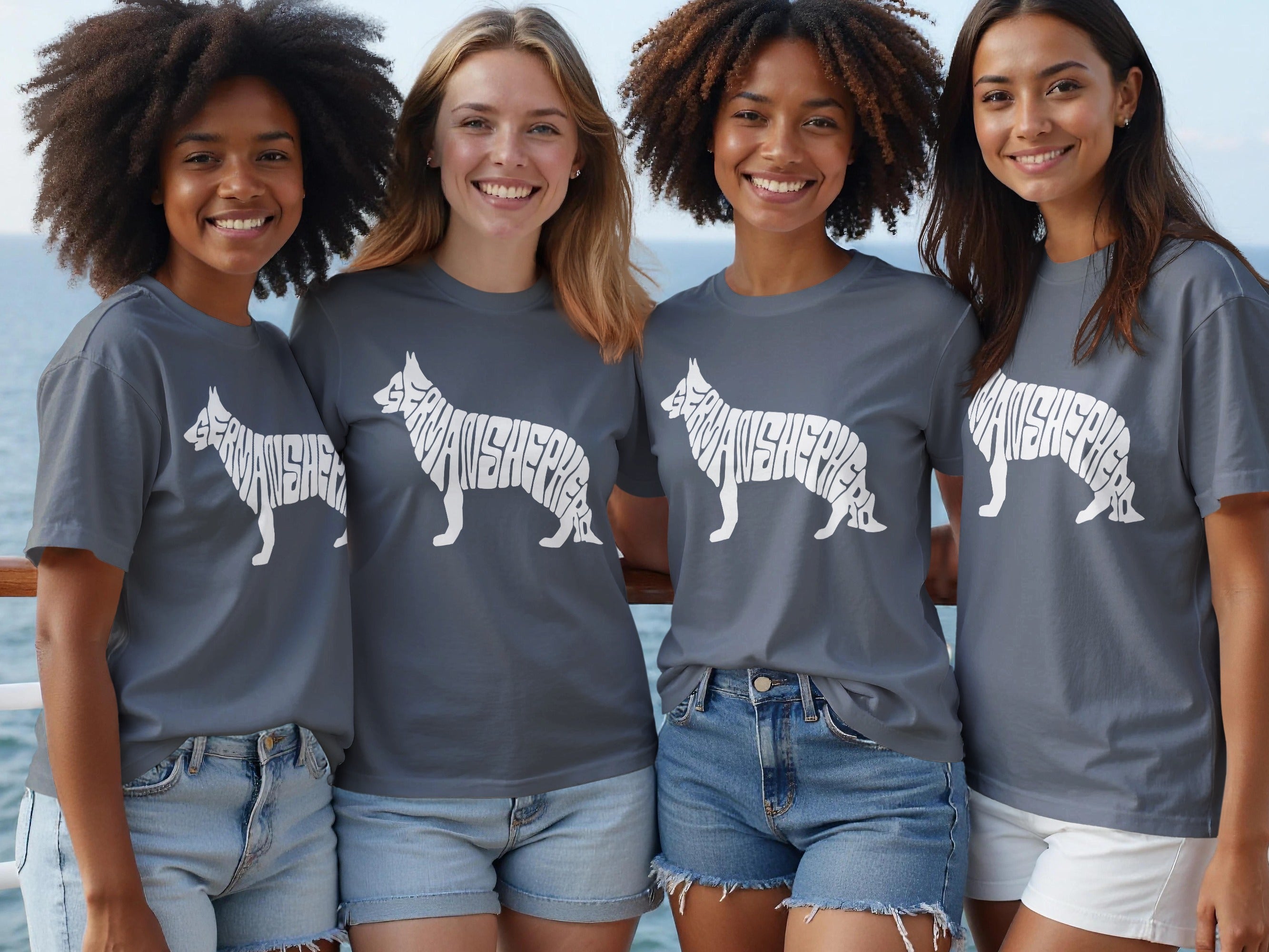 Four women wear grey shirts with a German Shepherd silhouette made of text.