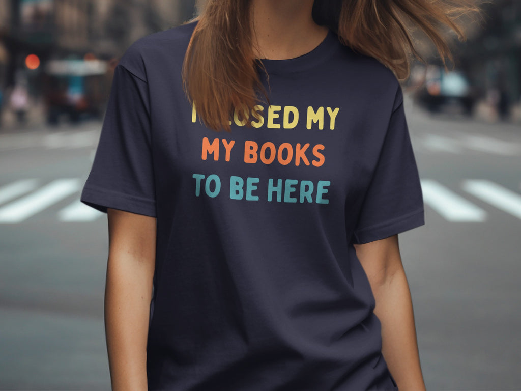 Navy t-shirt with "I CLOSED MY MY BOOKS TO BE HERE" text.
