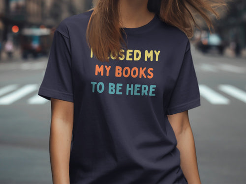 Navy t-shirt with "I CLOSED MY MY BOOKS TO BE HERE" text.