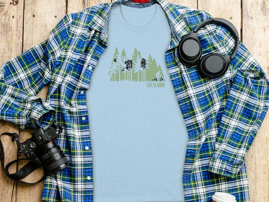 Light blue t-shirt with forest graphic and text "LIFE IS GOOD".