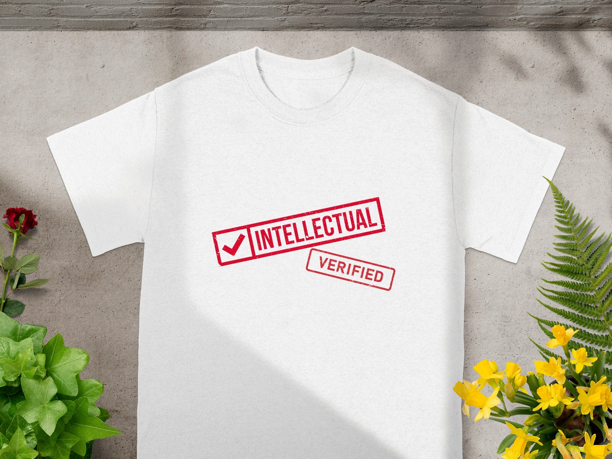 White t-shirt with red "INTELLECTUAL VERIFIED" stamp design.