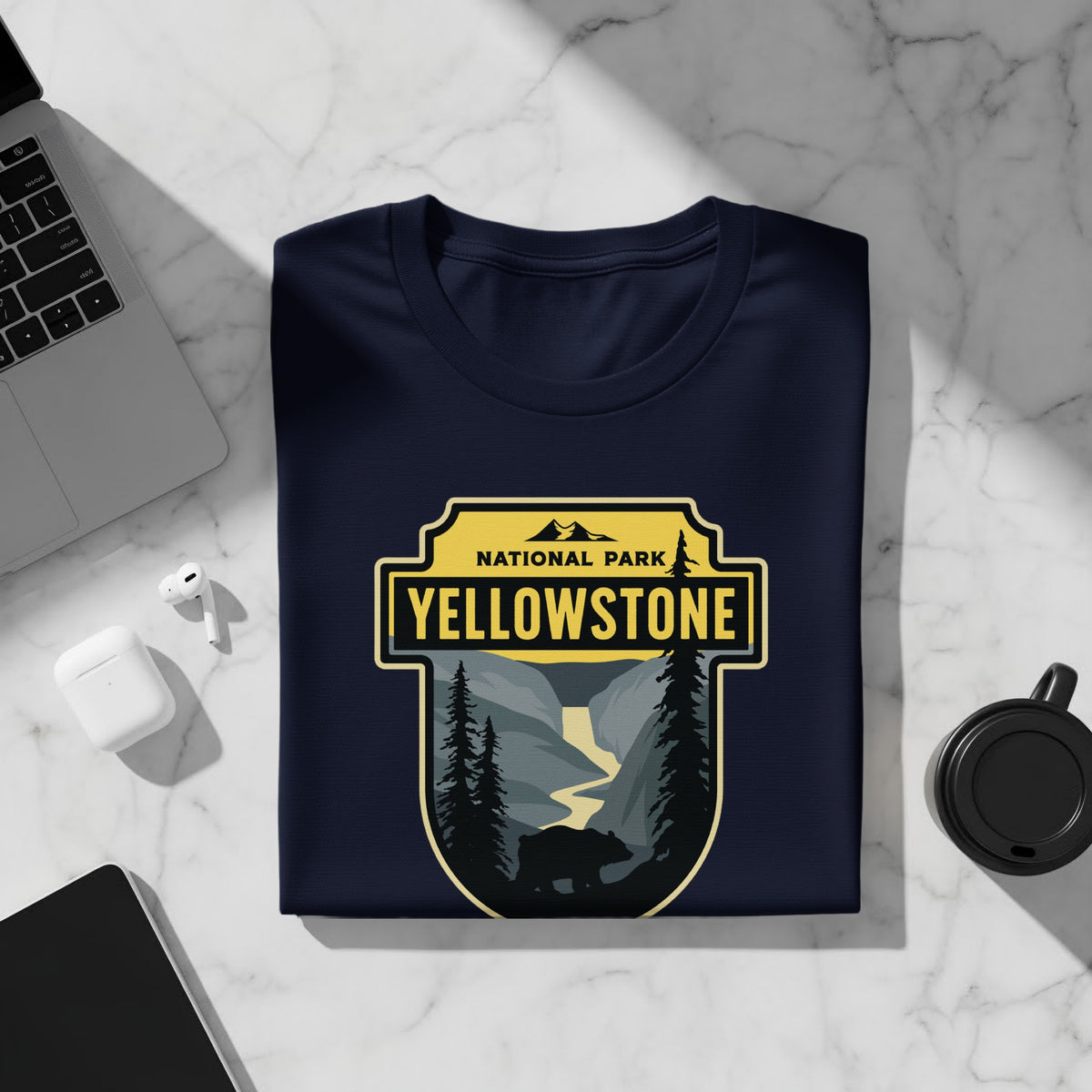 Dark blue t-shirt with Yellowstone National Park graphic featuring a bear and river.