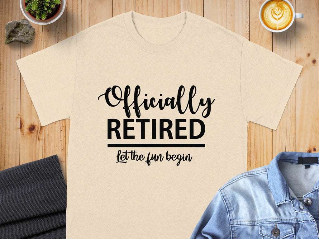 Cream t-shirt with black text "Officially RETIRED Let the fun begin".