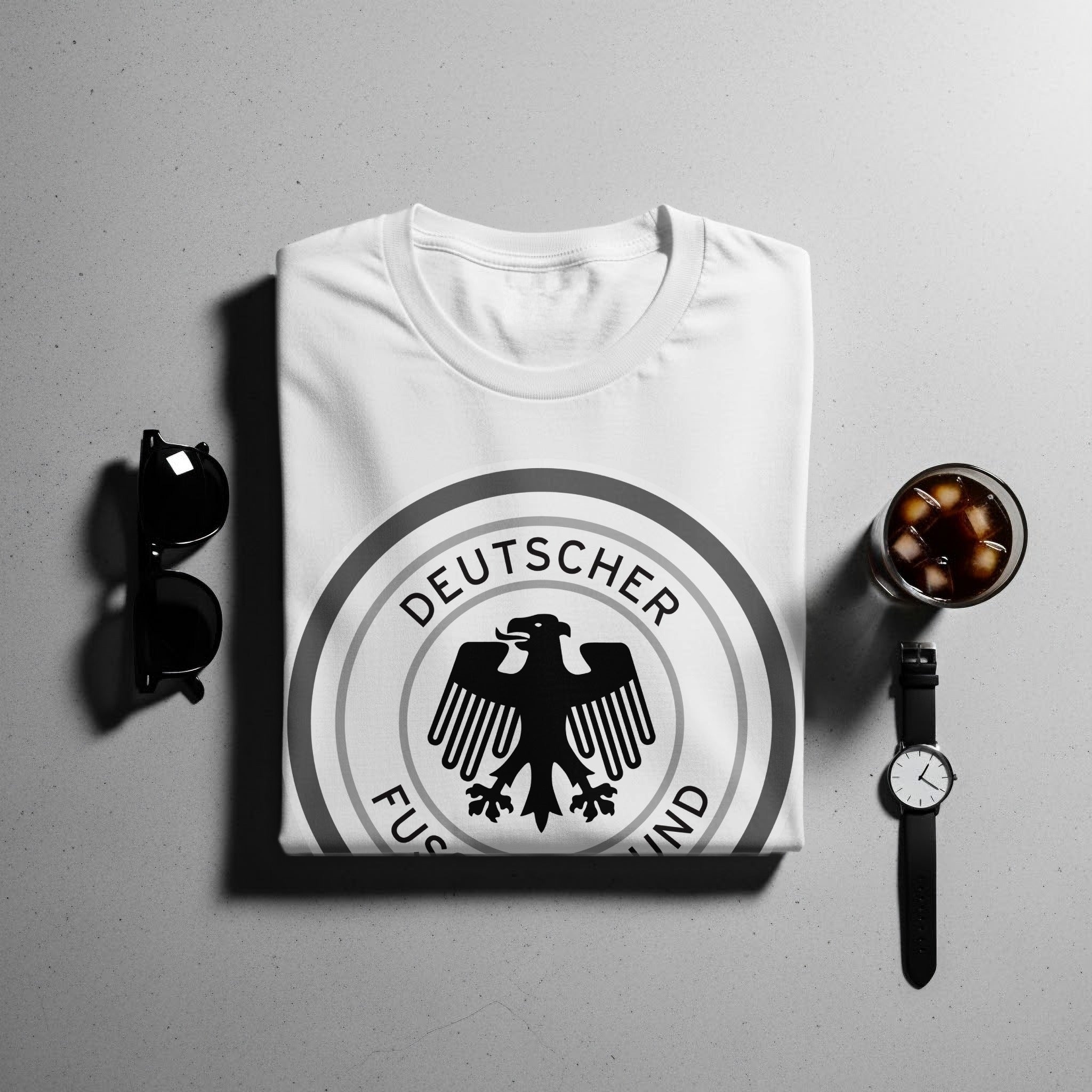 White t-shirt with German eagle crest and text "DEUTSCHER FUSSBALLBUND".