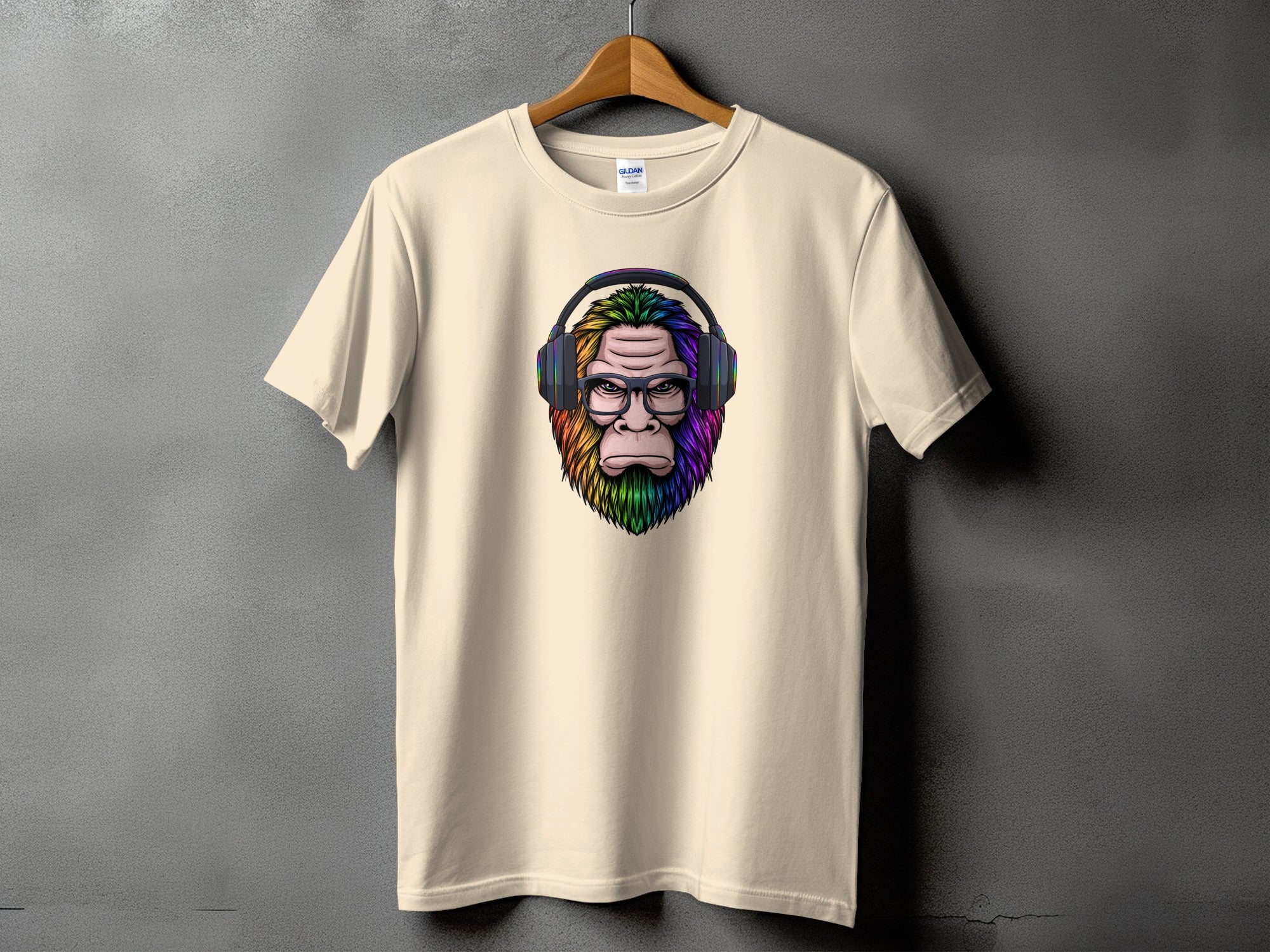 Cream t-shirt featuring a colorful ape head graphic wearing headphones and glasses.