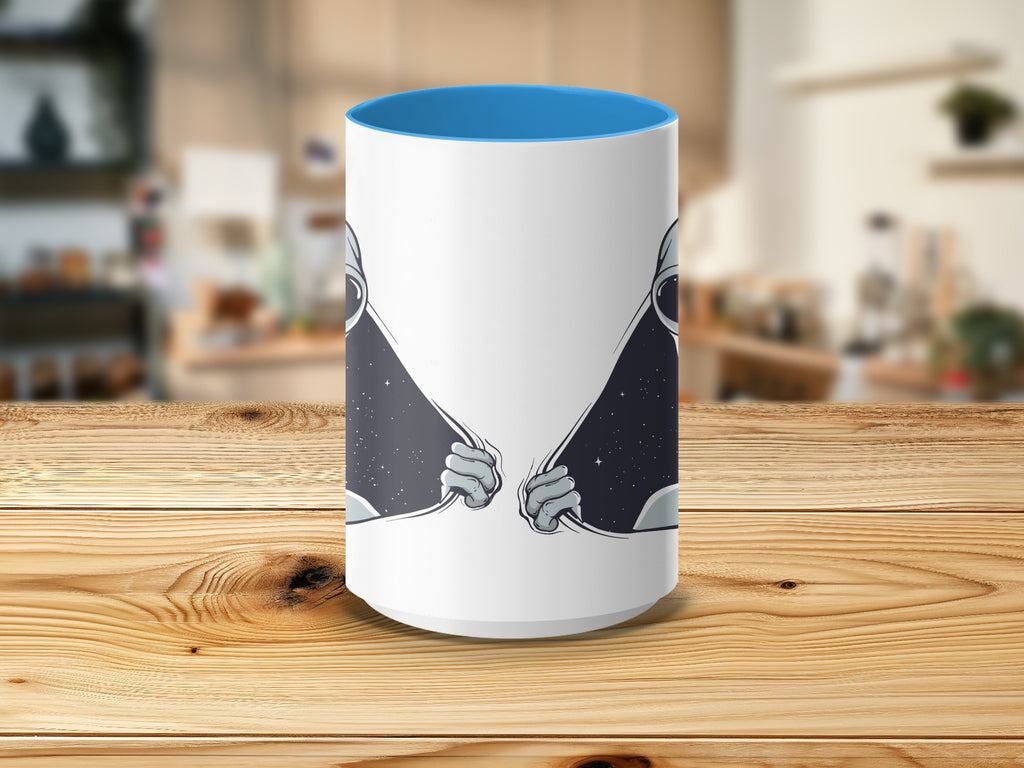 White mug with blue interior and astronaut hands pulling open a starry space background.