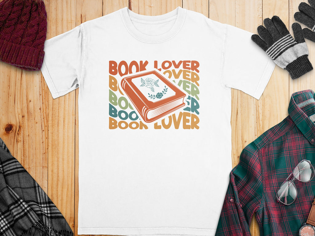 White t-shirt with "BOOK LOVER" text and a book graphic.