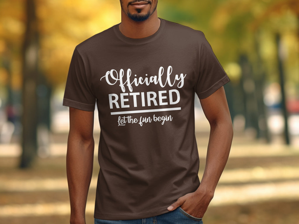 Brown t-shirt with white text reading "Officially RETIRED let the fun begin".