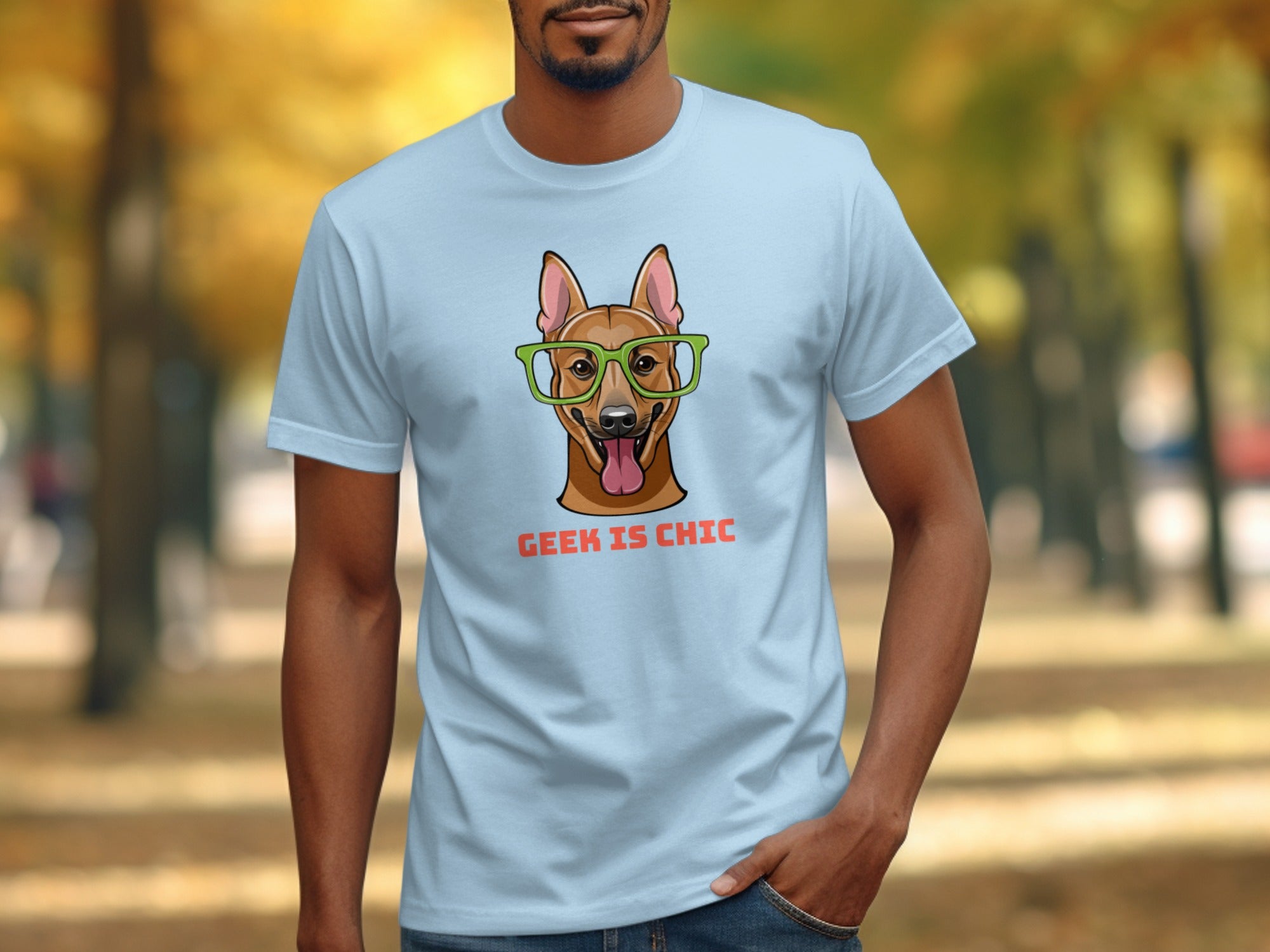 Light blue t-shirt with cartoon dog wearing glasses and text "GEEK IS CHIC".