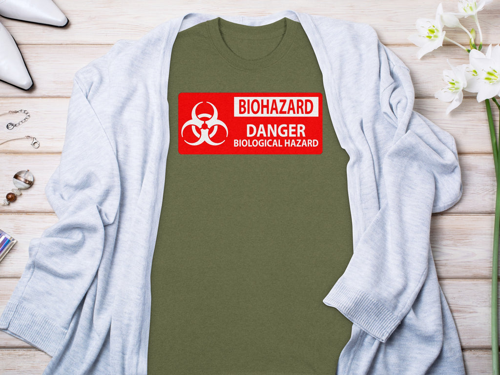 Olive green t-shirt with red biohazard danger biological hazard graphic.