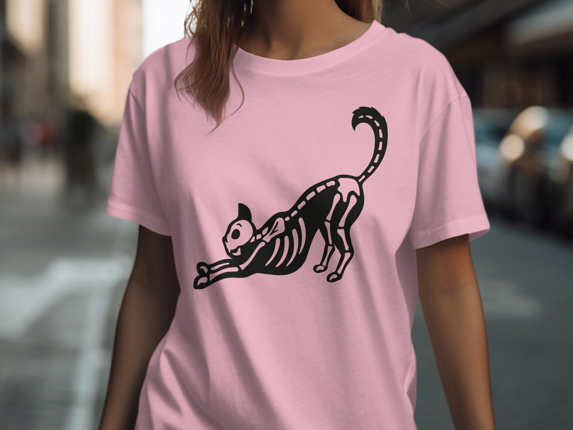 Pink t-shirt with black skeleton cat graphic.