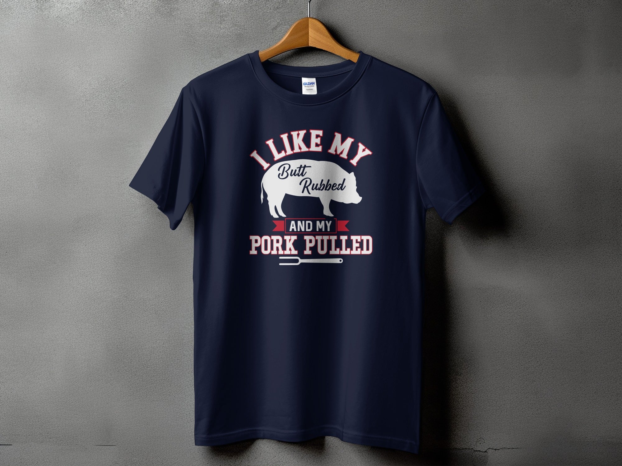 Navy t-shirt with "I Like My Butt Rubbed and My Pork Pulled" text and pig graphic.