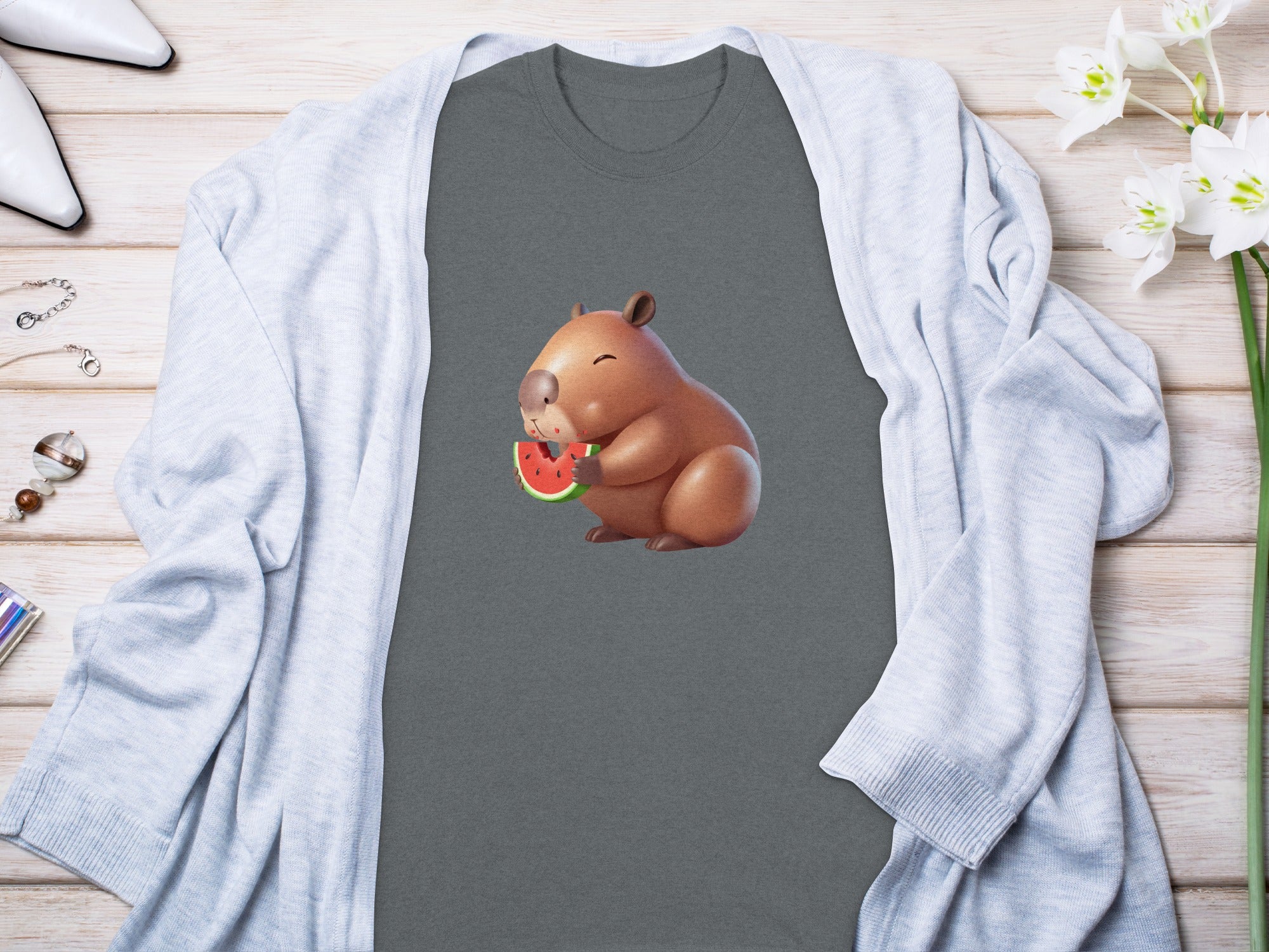 Capybara graphic eating a watermelon slice on a gray t-shirt.