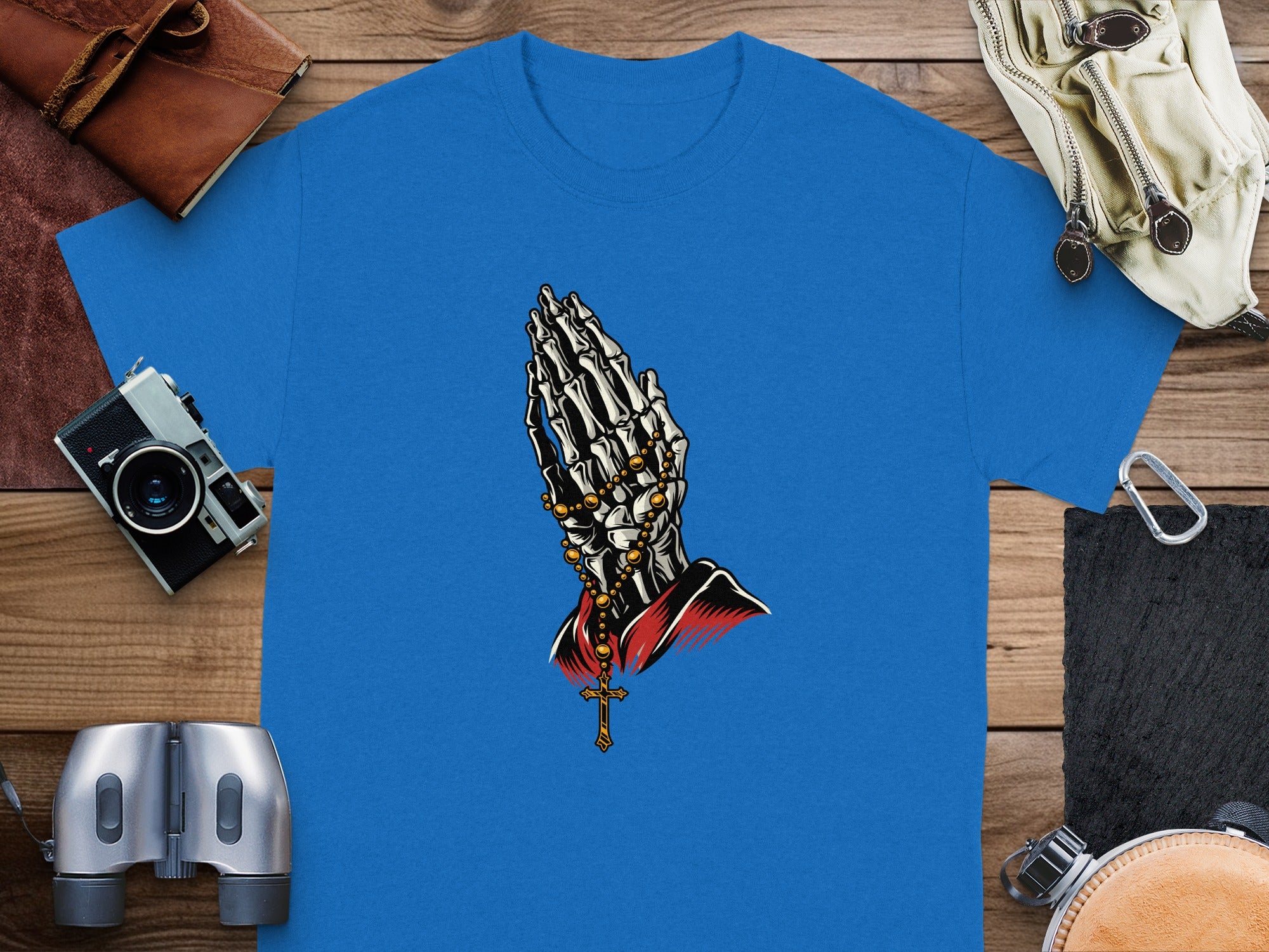 Blue t-shirt with skeleton praying hands and a rosary design.