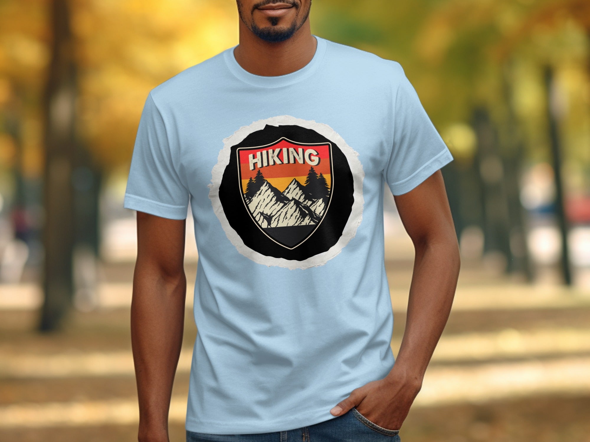 Light blue t-shirt with a distressed circular graphic featuring mountains and "HIKING" text.