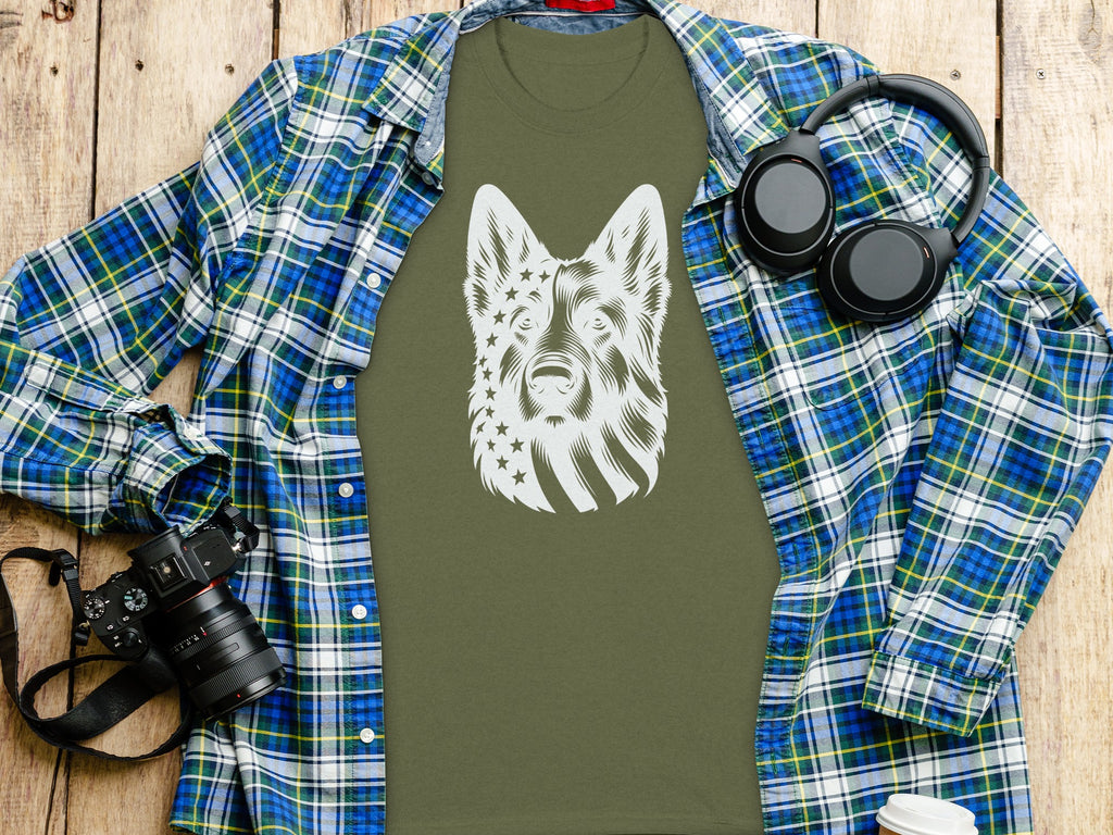 Green t-shirt with white German Shepherd American flag design, layered with plaid shirt.