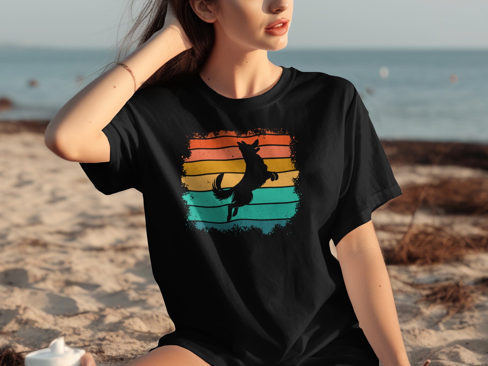 Black t-shirt with a jumping dog silhouette on retro stripes.