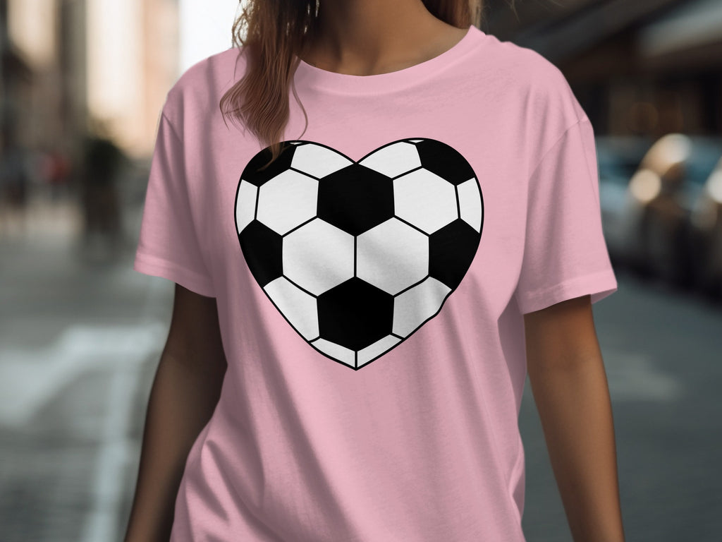 Pink t-shirt with a black and white soccer ball heart graphic.