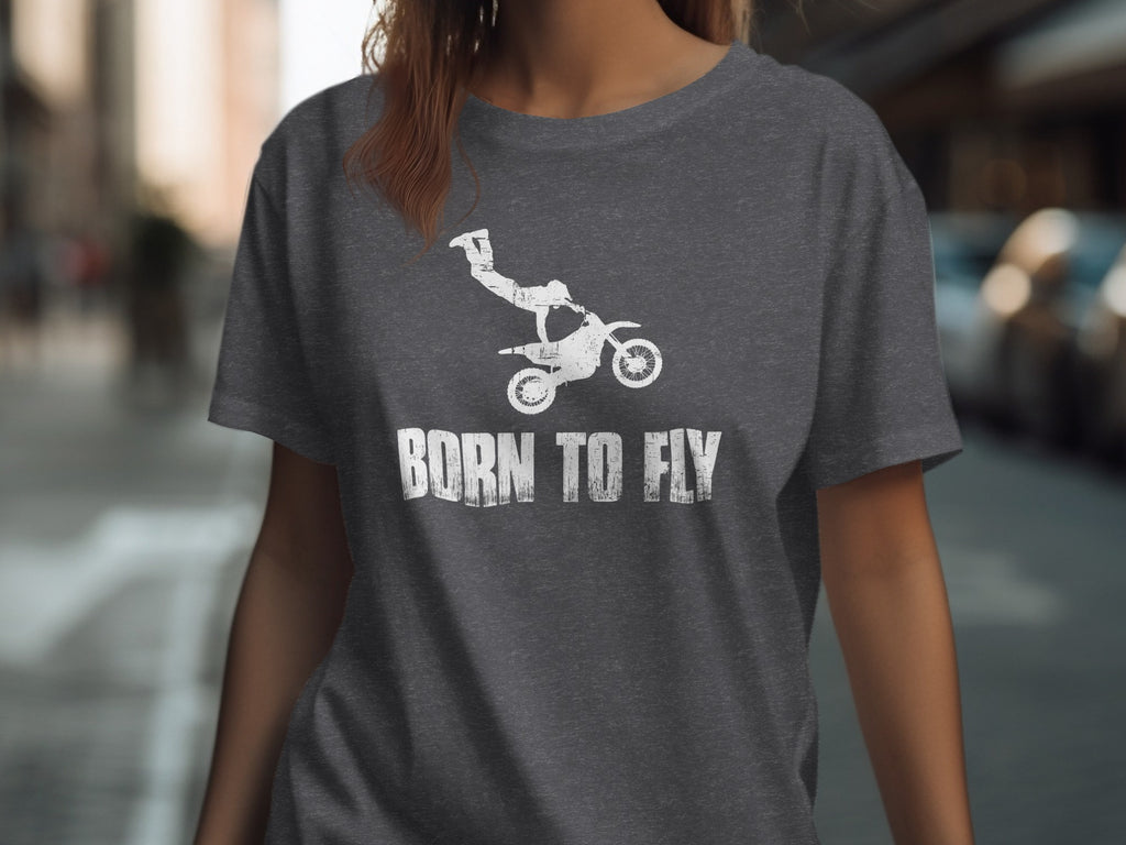 Dark gray t-shirt with white distressed graphic of a motocross rider and the text "BORN TO FLY".