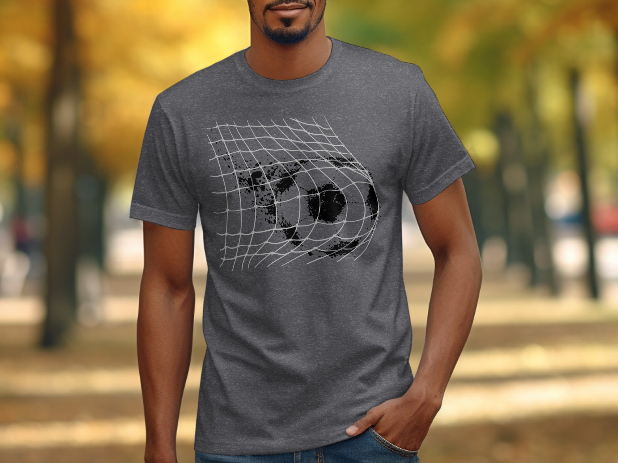 Graffiti soccer ball in net graphic on a dark grey t-shirt.