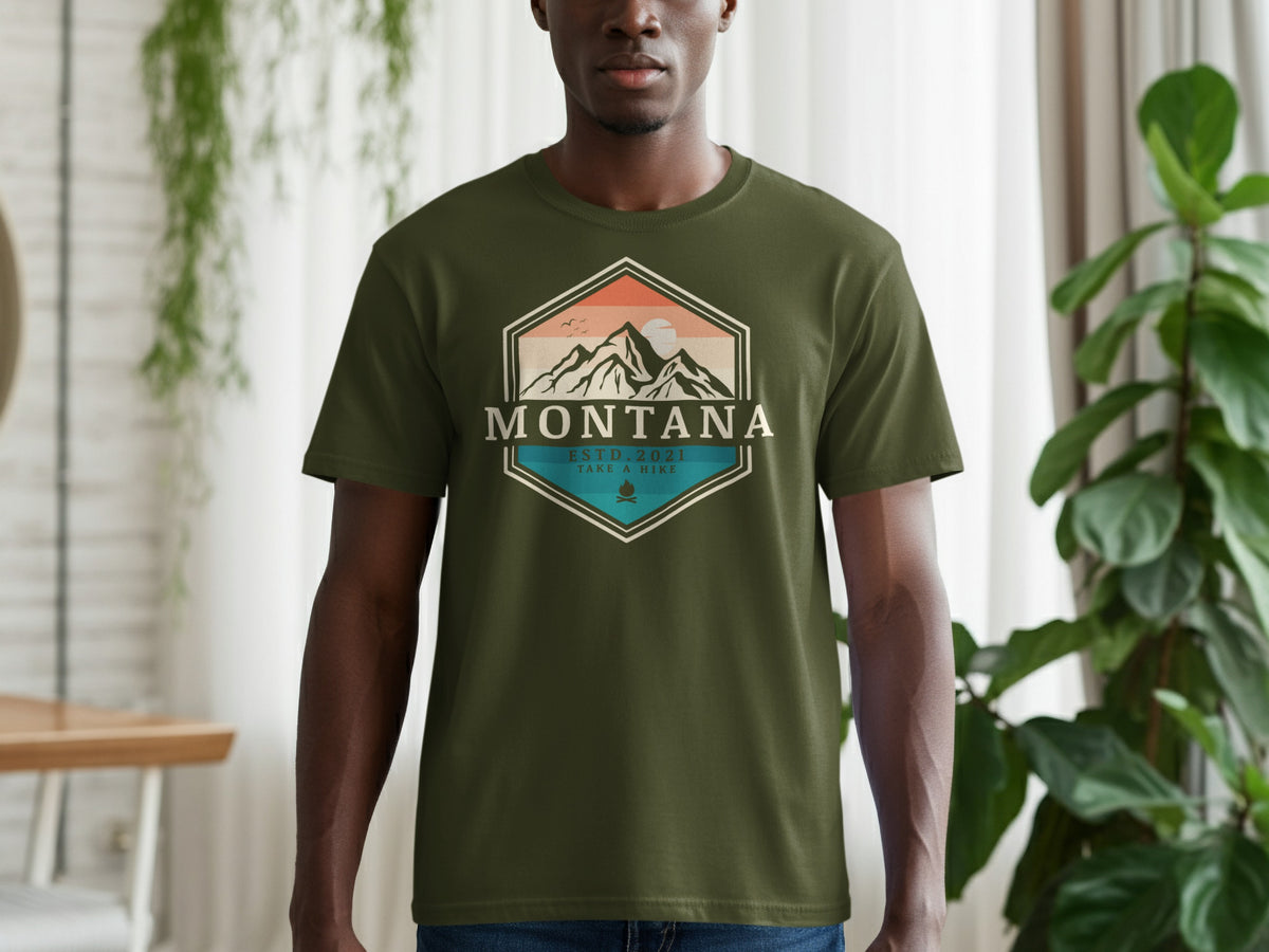 Green t-shirt with "Montana ESTD. 2021 Take A Hike" and mountain graphic.