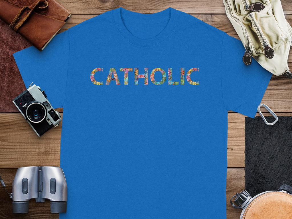 Blue t-shirt with "CATHOLIC" in colorful floral letters.
