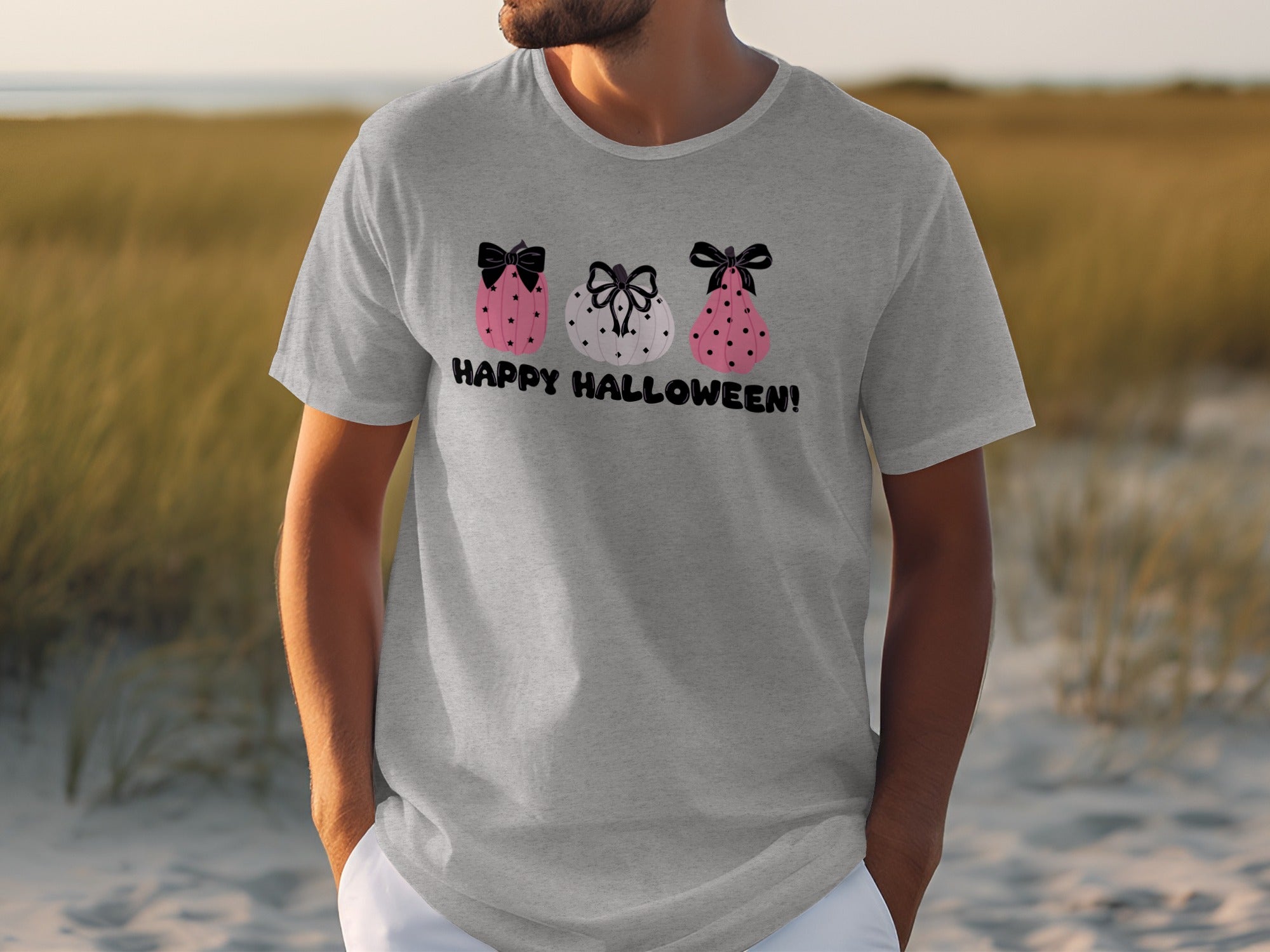 Grey t-shirt with three decorated pumpkins and "Happy Halloween!" text.