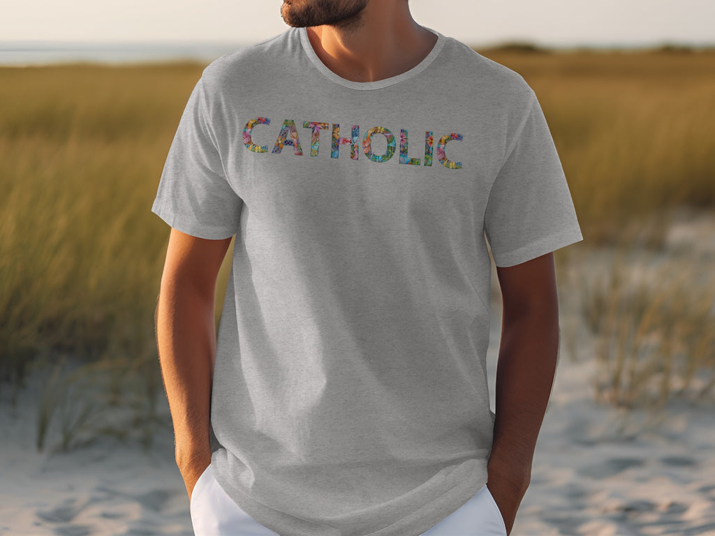 Grey t-shirt with colorful letters spelling CATHOLIC on chest.