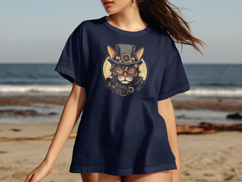 Dark blue t-shirt with steampunk cat graphic on a beach background.